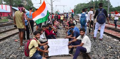 Youngsters block railway tracks in protest against the Centre's Agnipath scheme, in Dhanbad, Friday, June 17, 2022. Photo: PTI