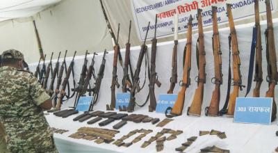 Arms and ammunitions of Maoists, recovered during an operation, being displayed, in Narayanpur, Chhattisgarh, Thursday on May 22, 2025. Photo: PTI
